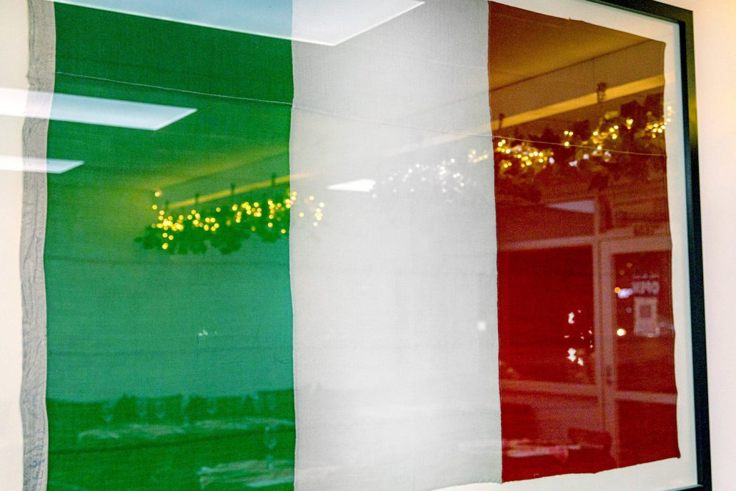 Image showing a framed Italian flag on the wall at Minos Mediterranean Cuisine, Howick