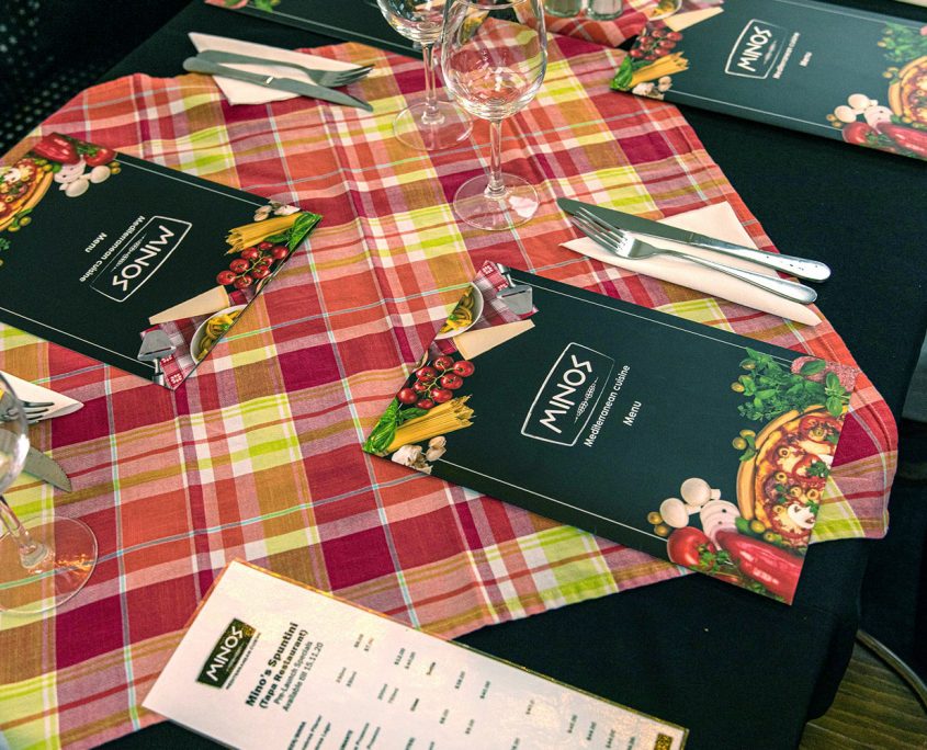 Image showing menus on a table in the dining area of Minos Mediterranean Cuisine in Howick.