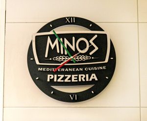 Image showing the Minos Pizzeria sign up on the wall